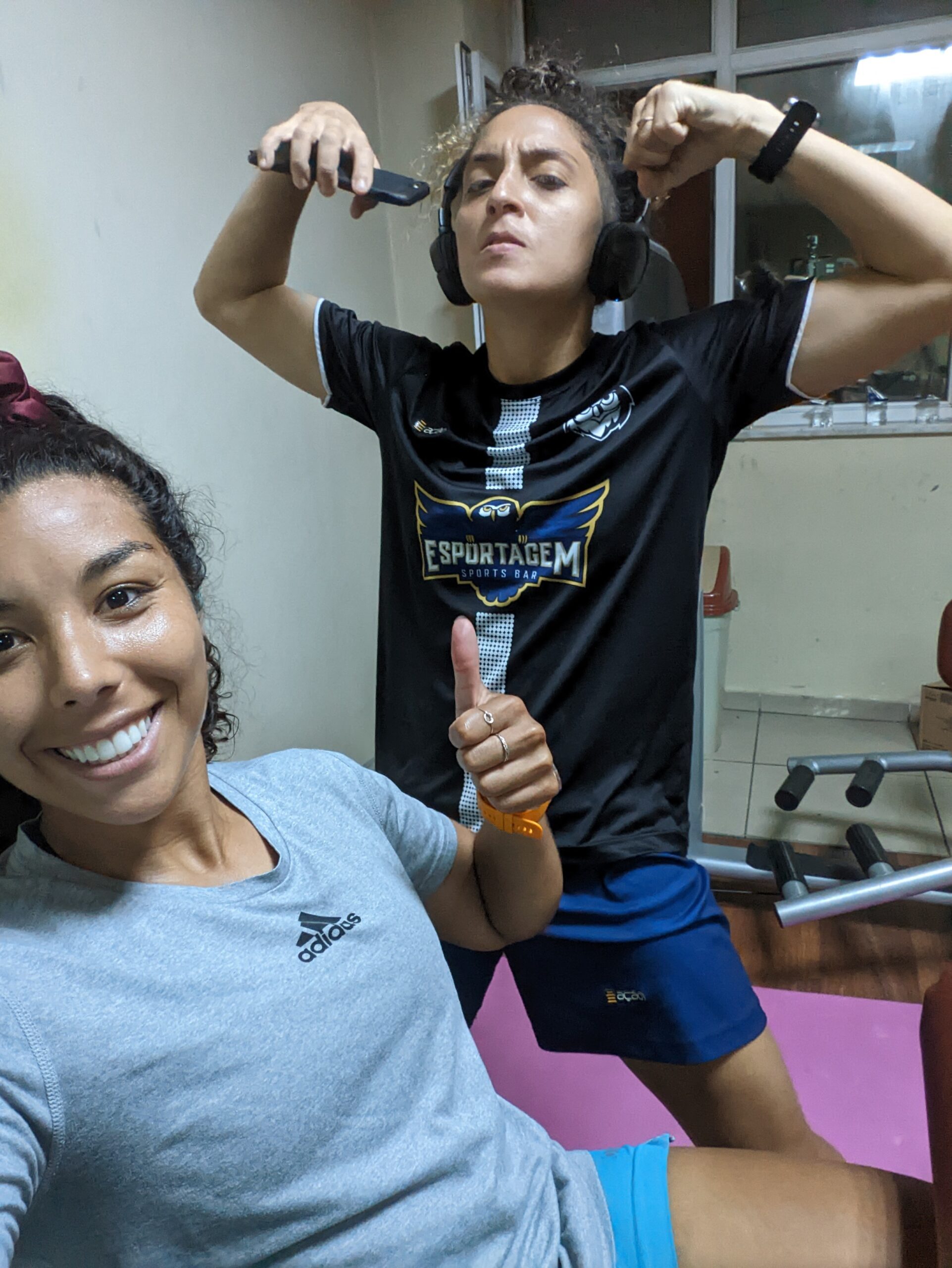 two girls happy at the gym